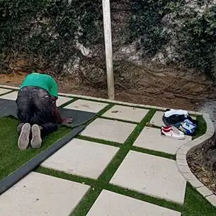 placing artificial turf stepping stones edging stones